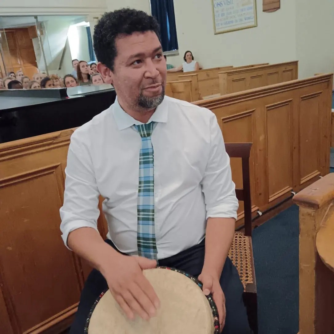 Chester Meyer playing drum in church