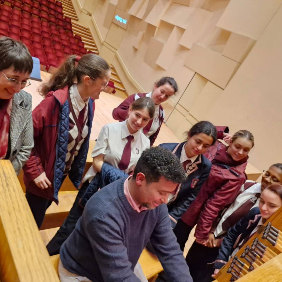 Chester Meyer with students at the organ